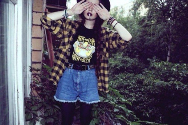 Light yellow and black plaid shirt paired with flowy mini jean shorts