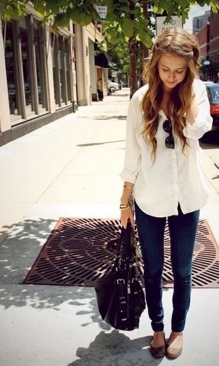 Light yellow long button down blouse and slim fit black jeans