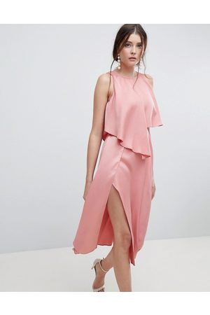 Peach sleeveless blouse with matching high slit midi skirt