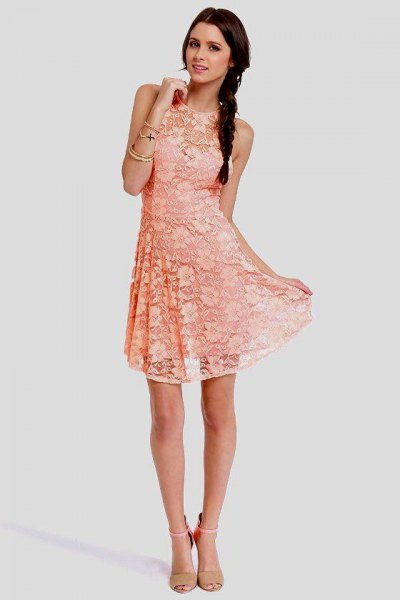 Peach lace sleeveless flared mini dress with pink heels