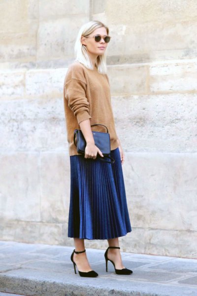 Pink chunky knit sweater with dark blue pleated midi skirt