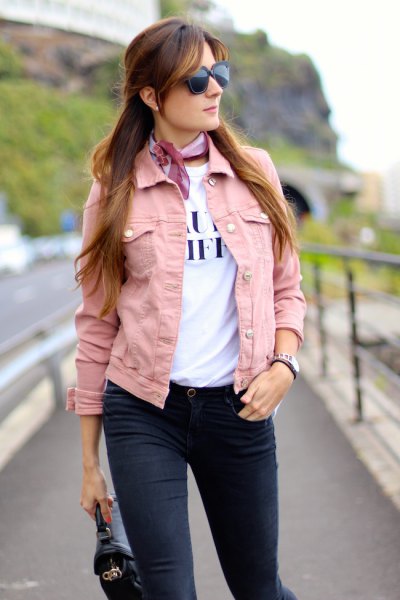 Pink denim jacket with white printed t-shirt and light blue silk
collar