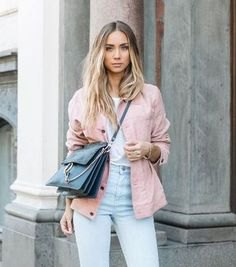 pink jacket with white t-shirt and light blue mom jeans