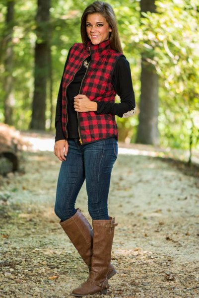 Red and black checkered waistcoat with a stand-up collar and brown knee-high leather boots