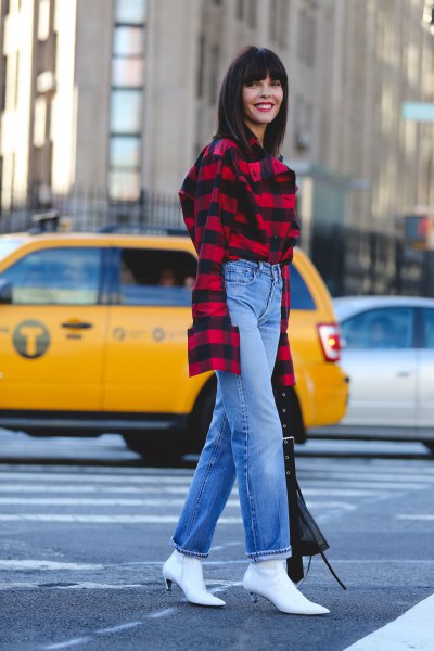 Red and black plaid shirt, blue straight-leg jeans, and white
kitten heel boots