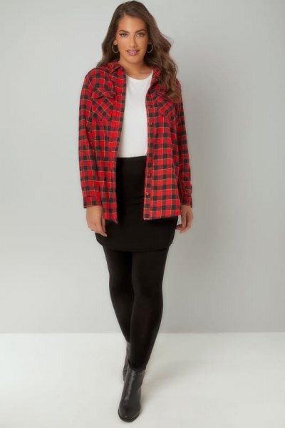 red and black checked shirt with leggings and short leather boots