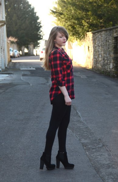 In addition a red and black checked shirt with super skinny jeans and high-heeled boots