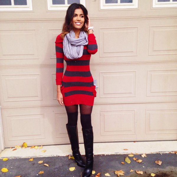 Red and dark blue striped figure-hugging sweater dress with black overknee boots