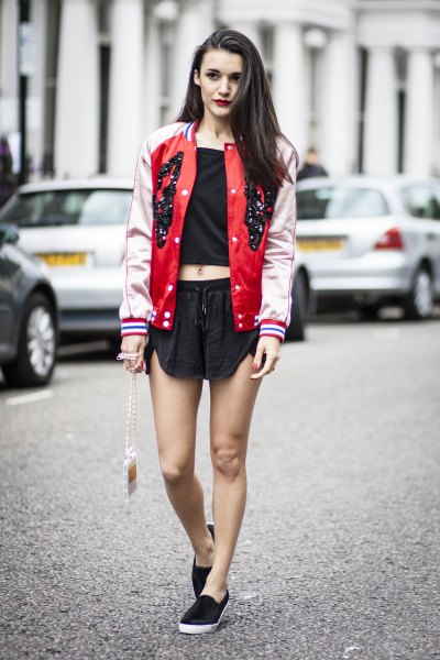 Red and light pink baseball bomber jacket with black mini shorts
