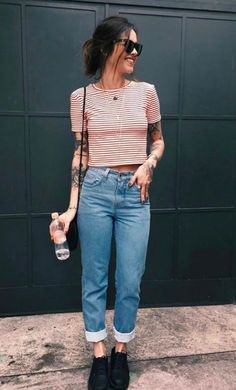 Red and white cropped t-shirt with blue high-rise straight-leg jeans