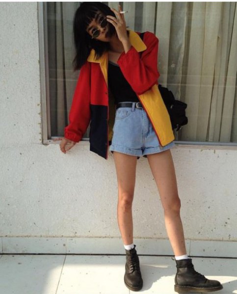 Red, black and yellow color block windbreaker with light blue mini denim shorts