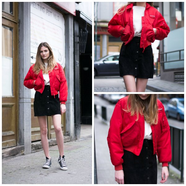 Red bomber jacket with black denim mini skirt with button front closure