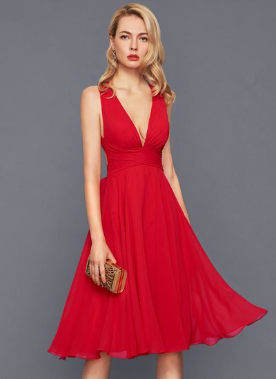 Red deep V-neck flared midi dress with clutch handbag