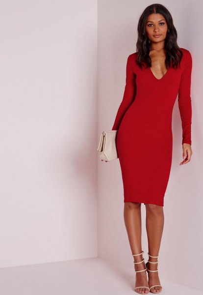 Red long sleeve midi dress with a deep V neckline and white open heels