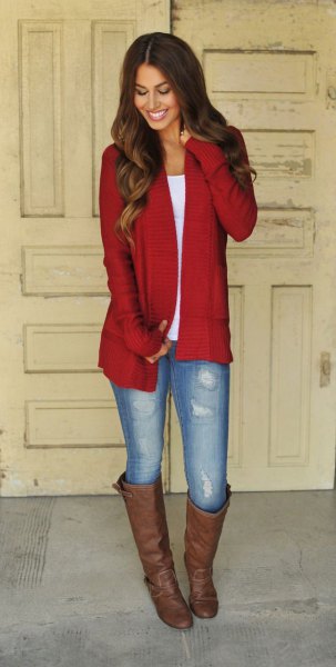 Red long cardigan with white scoop neck t-shirt and brown knee high boots