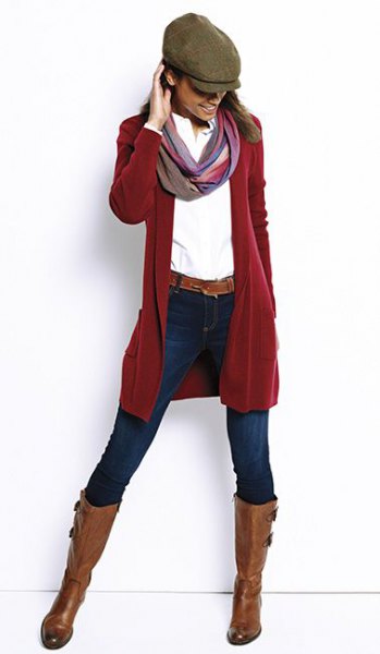red longline cardigan with white shirt and flat cap