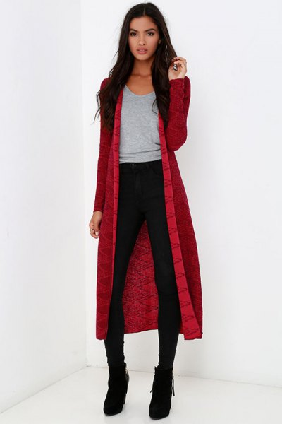 Red midi cardigan worn with a gray scoop neck t-shirt and black skinny jeans