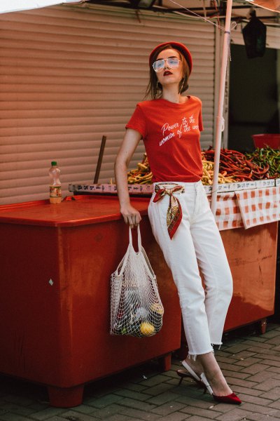 Red printed t-shirt with white cropped straight-leg jeans