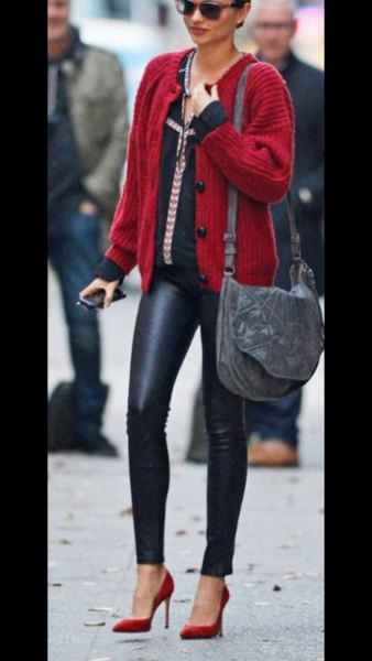 Red ribbed cardigan and black skinny leather pants