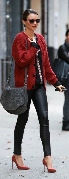 Red ribbed cardigan with black top and leather leggings