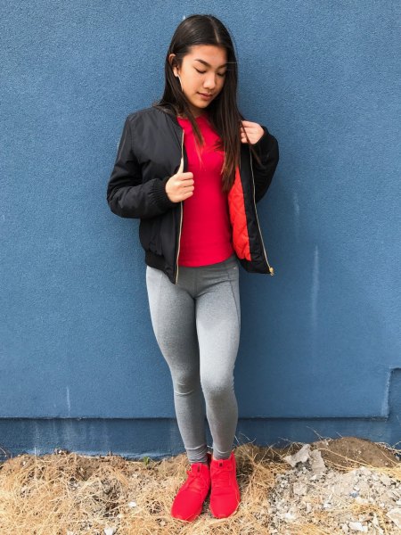 red t-shirt with black bomber jacket and gray leggings