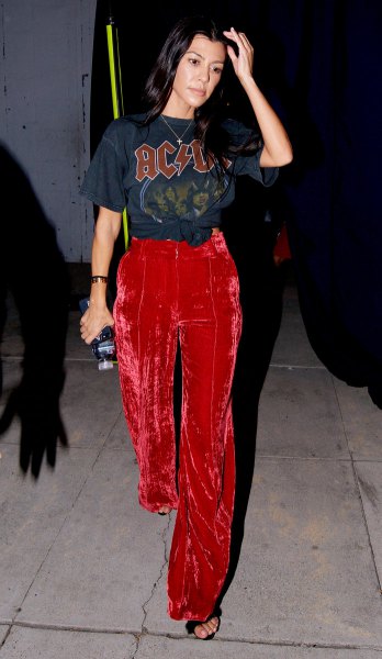 Red velvet wide leg trousers and black graphic tee