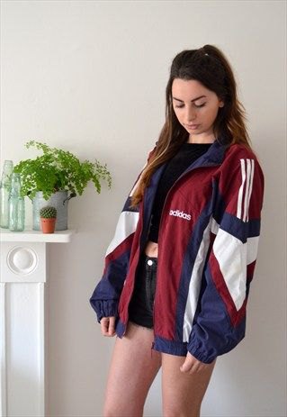 Red, white and navy blue vintage windbreaker jacket with black mini jean shorts