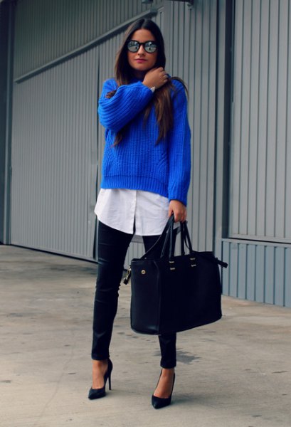 ribbed blue sweater over a long button-down white shirt