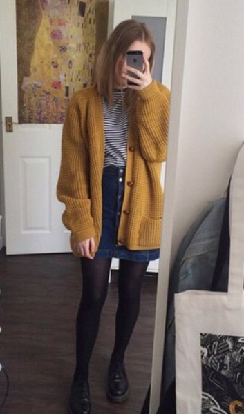 Ribbed dark mustard yellow sweater jacket with blue denim skirt with buttons at front