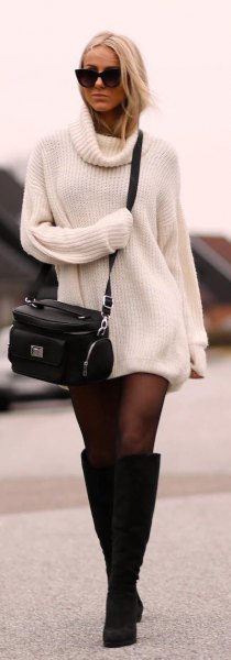 ribbed white sweater dress with black stockings and knee high boots