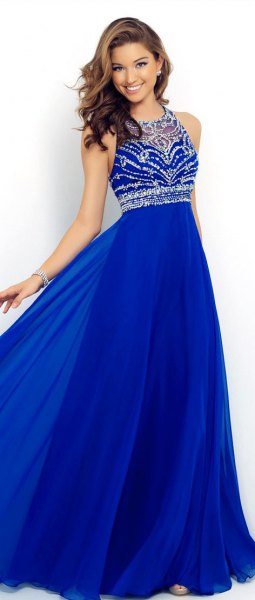 Royal blue and silver sequined halterneck dress with a flared silhouette
