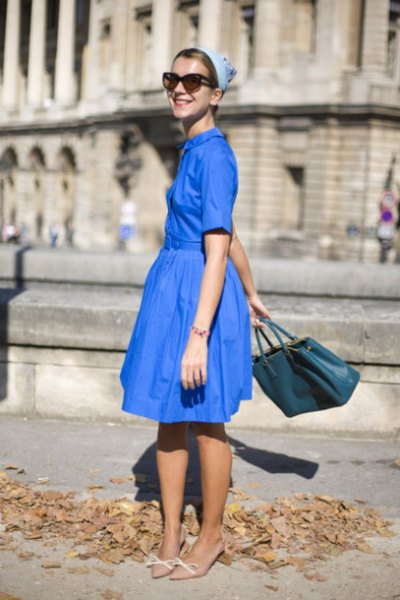 Royal blue fit and flare midi dress with light pink kitten heel pumps