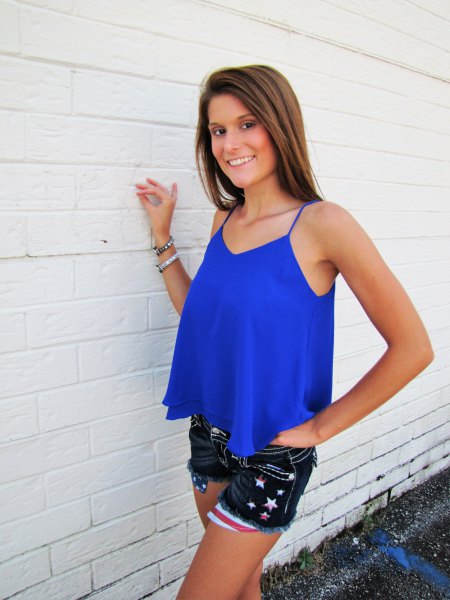 Royal blue flowy tank top with black embroidered mini jean shorts
