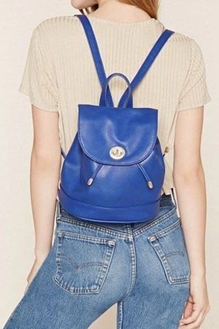 Royal blue leather backpack purse with pale pink short sleeve top