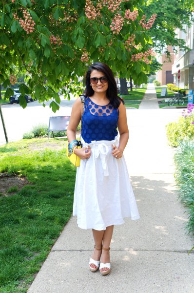 Royal blue sleeveless tank top with white cotton flared midi skirt to tie at waist
