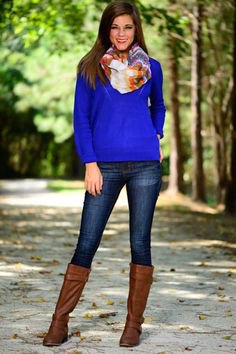 Royal blue sweater with floral printed silk scarf and knee high boots