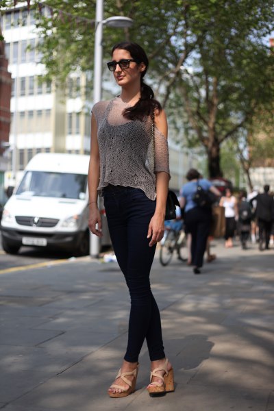 Transparent blouse with a black tank top and skinny jeans