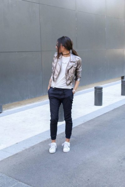 Silver blazer with black cropped jogger jeans and white sneakers
