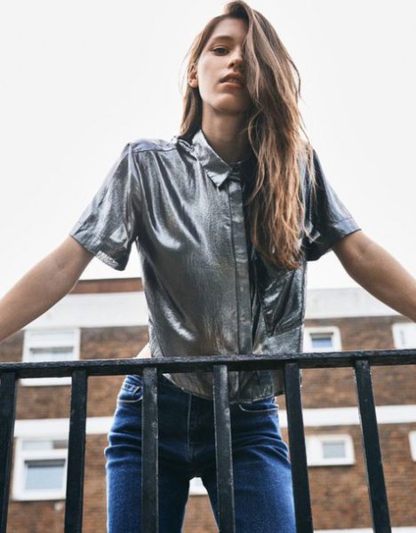 Silver metallic short sleeve shirt with blue jeans
