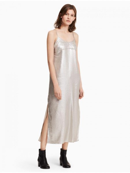 Silver scoop neck maxi dress with spaghetti straps and black leather ankle boots