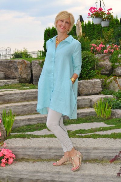 Sky blue extra long tunic shirt with buttons and light gray skinny jeans