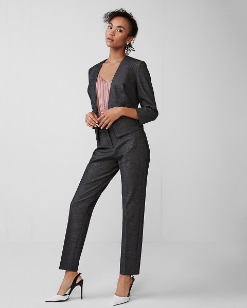Slim fit suit with a striped V-neck top and white heels