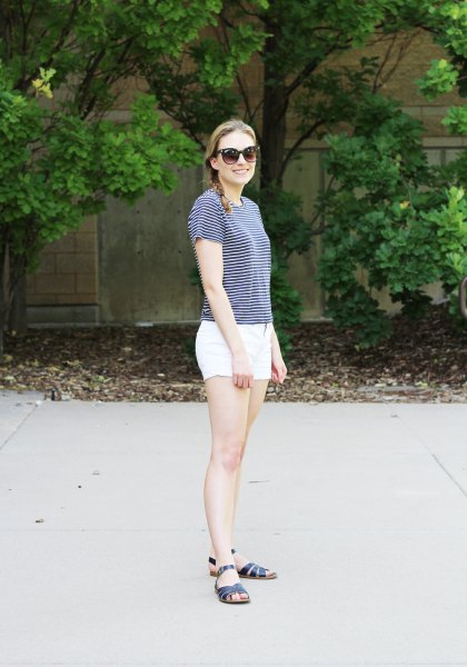 Striped t-shirt with white mini cotton shorts and black slide sandals