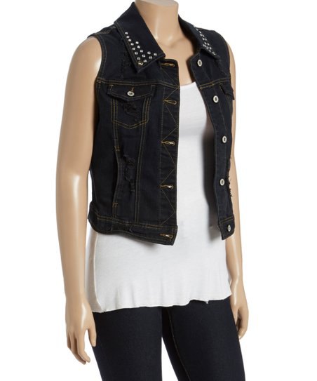 Black, waisted denim vest with a rivet collar and a white tunic
tank top