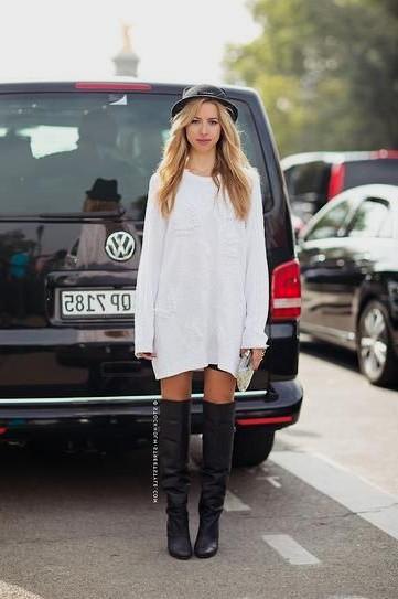 Sweater dress with black thigh high leather boots