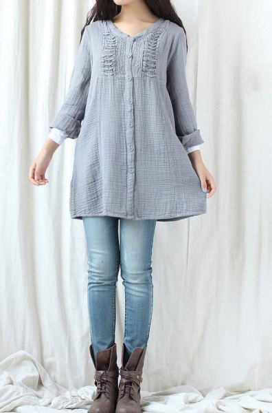Teal cotton tunic top with ruffles and light blue jeans