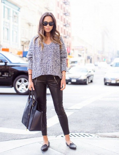 Heather gray chunky knit sweater with a V-neckline, leather leggings and slippers