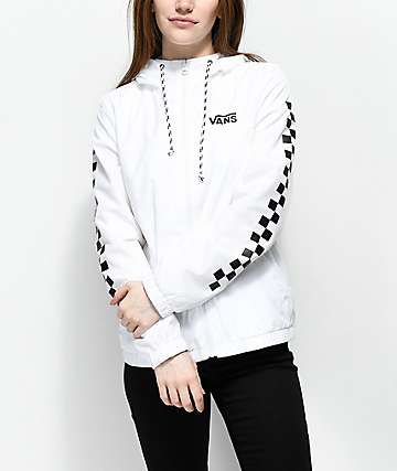 White and black checked windbreaker with dark jeans