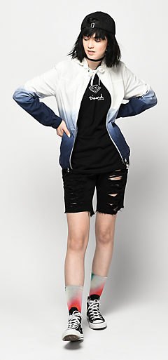 White and black gradient windbreaker jacket and ripped mini denim shorts