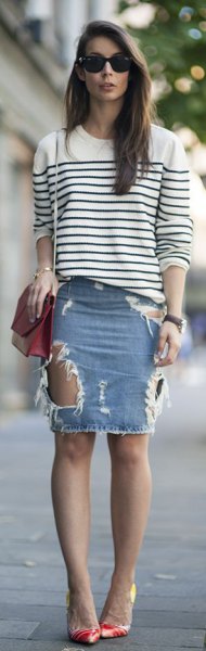 White and black striped crew neck knit sweater with light blue denim mini skirt with rips